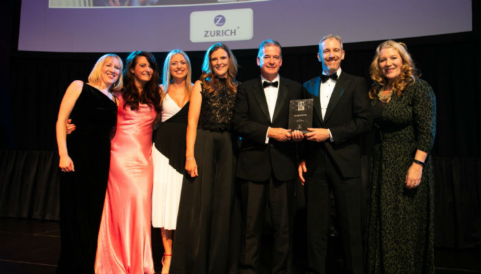 Joe Creegan from Zurich presents Three Ireland HR team with the HR Team of the Year Award