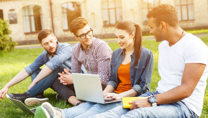 college students sithing with a laptop