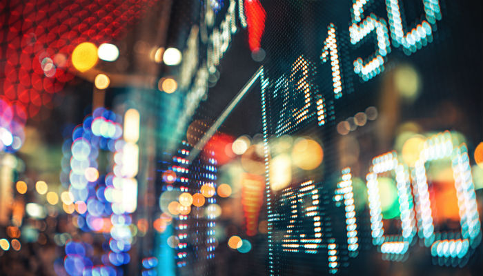 Display of Stock market quotes with city scene