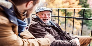 older man in wheelchair with younger man