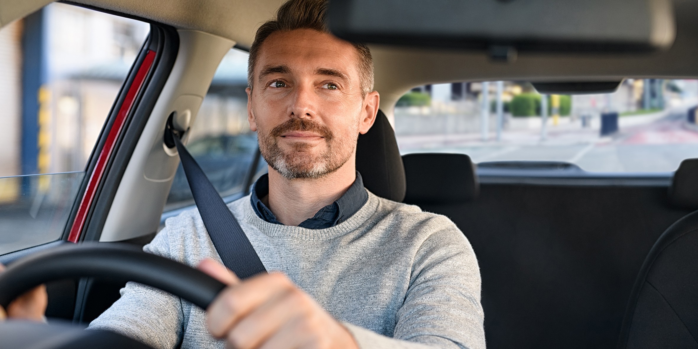 man driving car