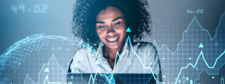 smiling businesswoman working on laptop