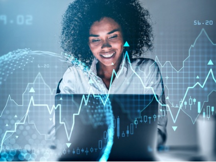 smiling businesswoman working on laptop