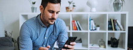 man at home on phone
