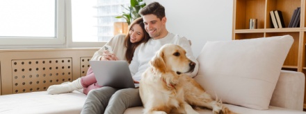 couple at home with dog