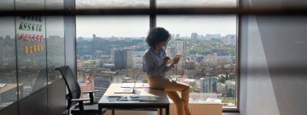 young woman in office on phone