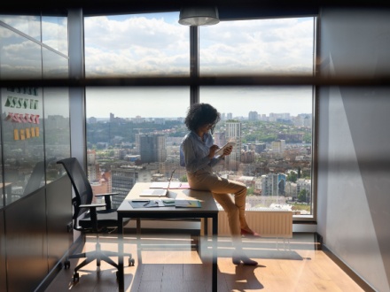 young woman in office on phone