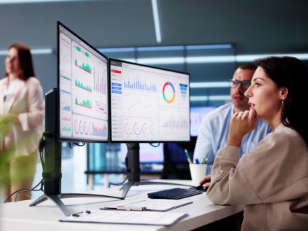 data analyst at computer screen