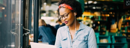 woman in coffee shop on laptop