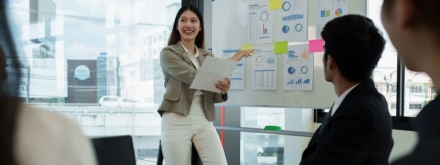female financial analyst giving work presentation