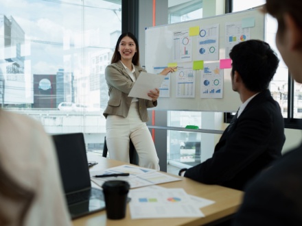 female financial analyst giving work presentation