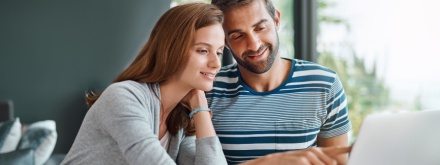 couple on laptop at home