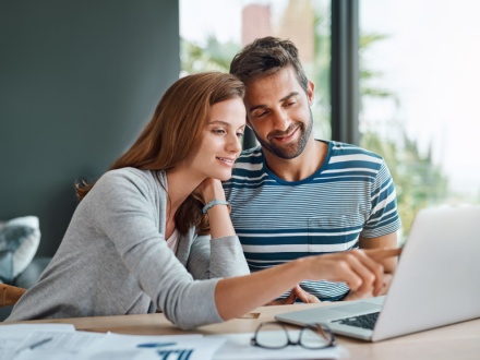 couple on laptop at home