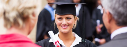 college student graduating with her parents
