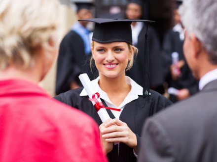 college student graduating with her parents