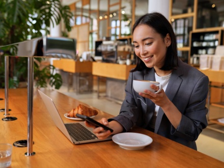 Woman in coffee shop on phone