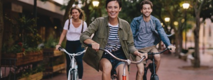 three young friends cycling bikes