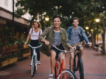 three young friends cycling bikes