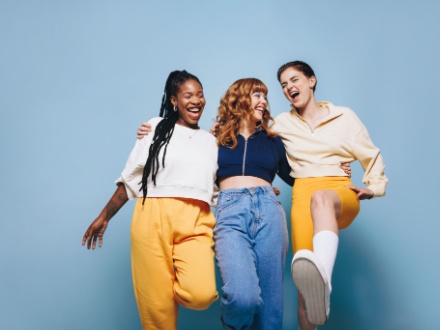 Group of three happy female friends