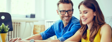 young couple calculating finances at home