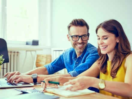 young couple calculating finances at home