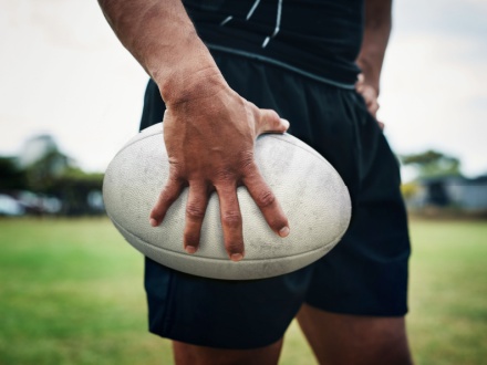 rugby player holding a rugby ball