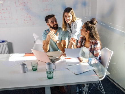 three office staff having a meeting