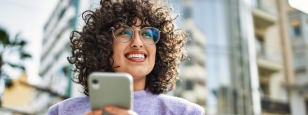 smiling young woman on phone