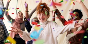 Action shot of young woman celebrating International Womens Day