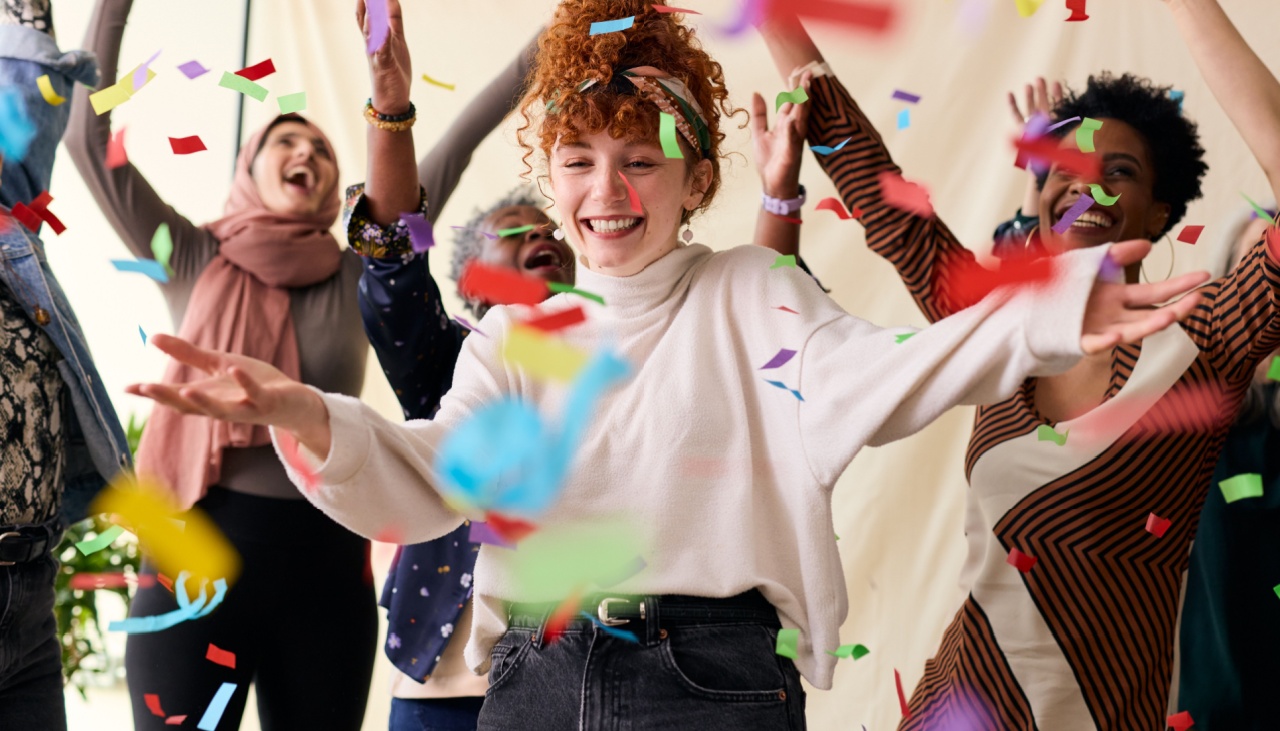 Action shot of young woman celebrating International Womens Day