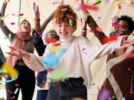 Action shot of young woman celebrating International Womens Day