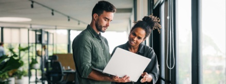 business people working together on laptop computer