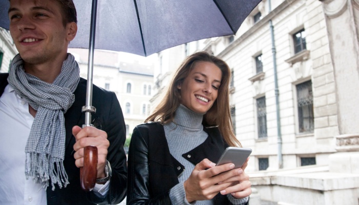 Man and woman in city on phone