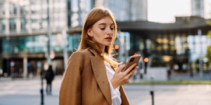 young business woman on phone in the city