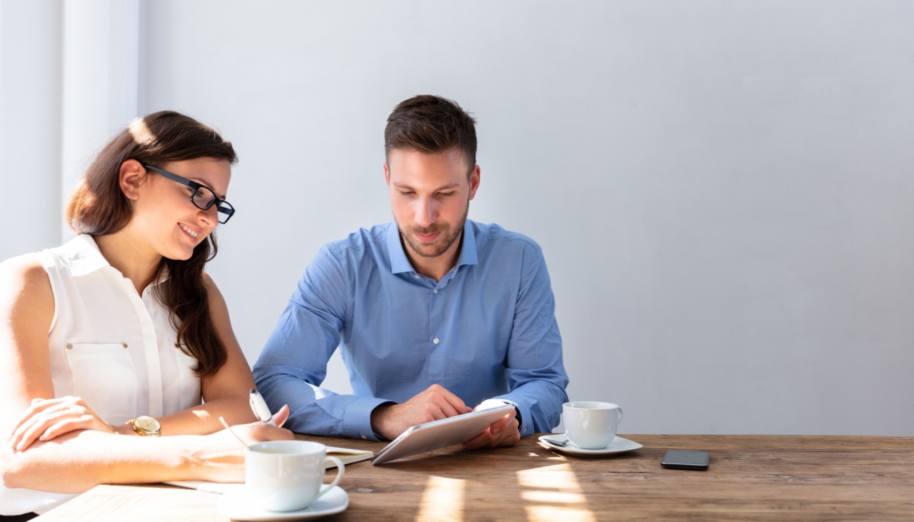 two work colleagues having coffee together