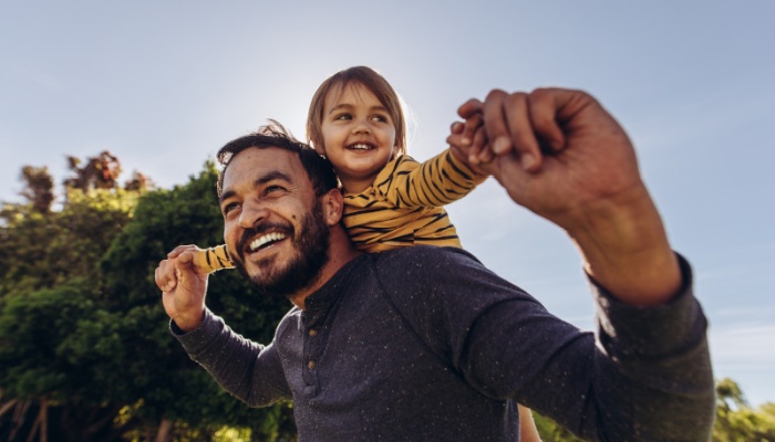 father with child on his shoulders