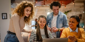 group of young people working in an office