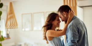 happy couple at home hugging