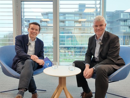 Ronan O'Neill from Broker Marketing and Denis O’Rourke Zurich financial planner sitting in office talking to each other