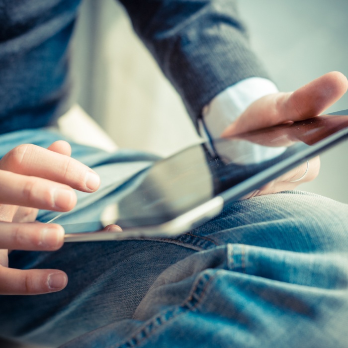 hands on a tablet