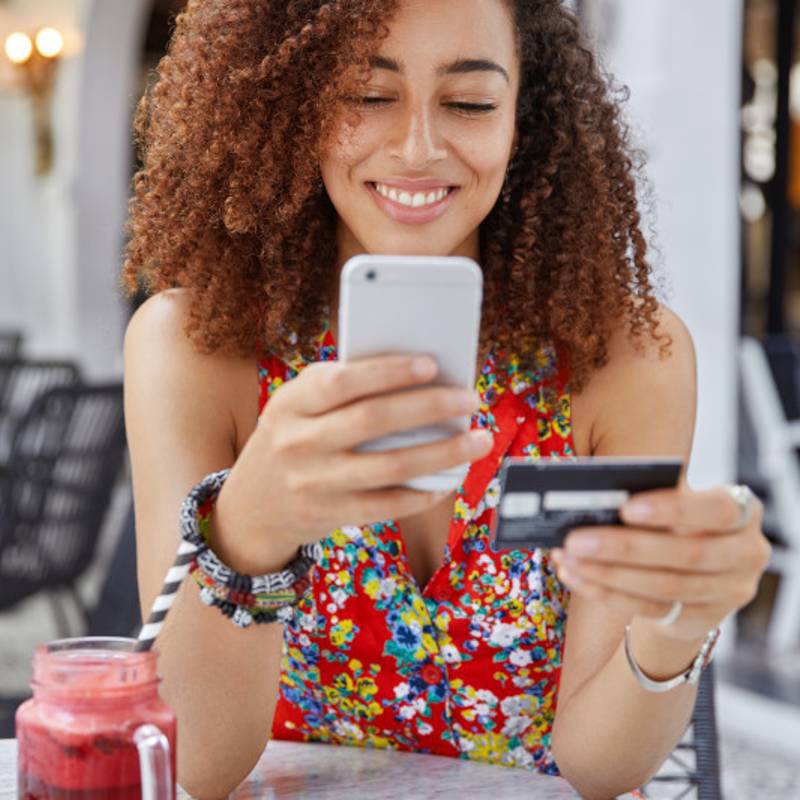 woman in coffee shop on mobile phone