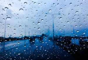 a car window with rain running down the windscreen