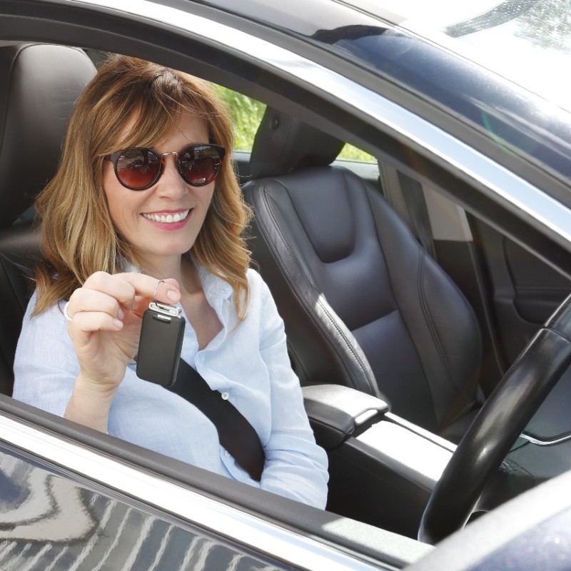 woman in car with keys