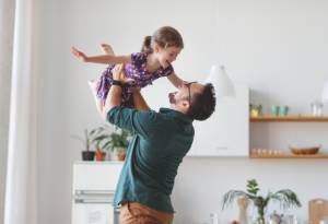 Dad playing with child