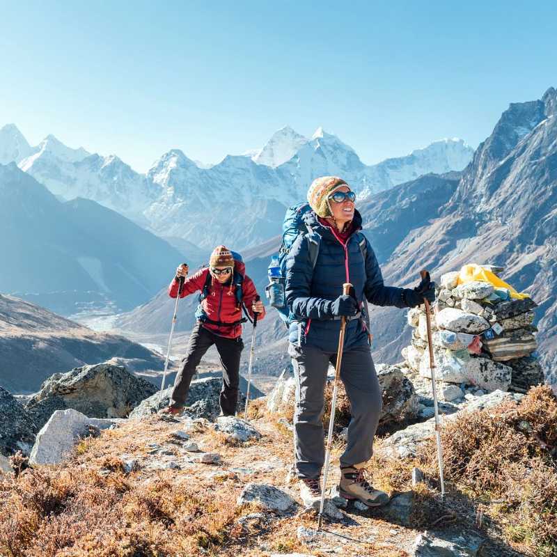 couple climbing mountain