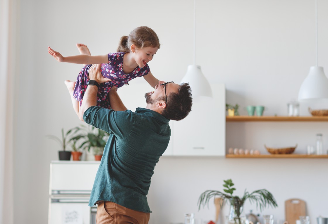 father and daughter playing at home