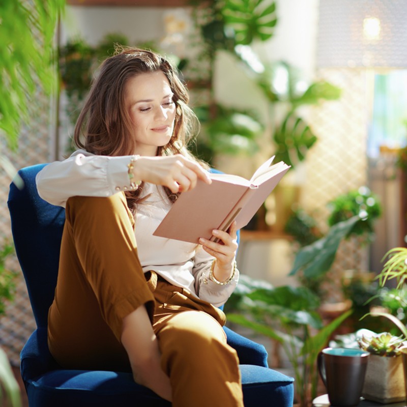 woman in garden reading book