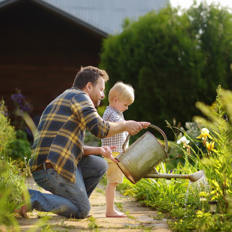 father and son in garden