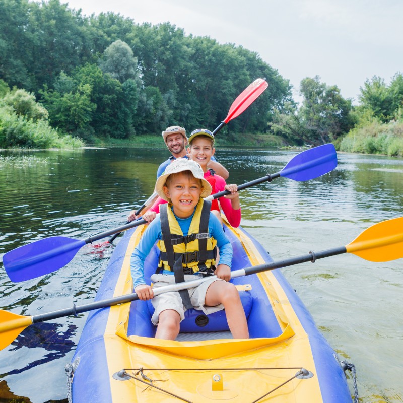 parents and children in canoe