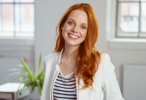 Smiling woman with red hair